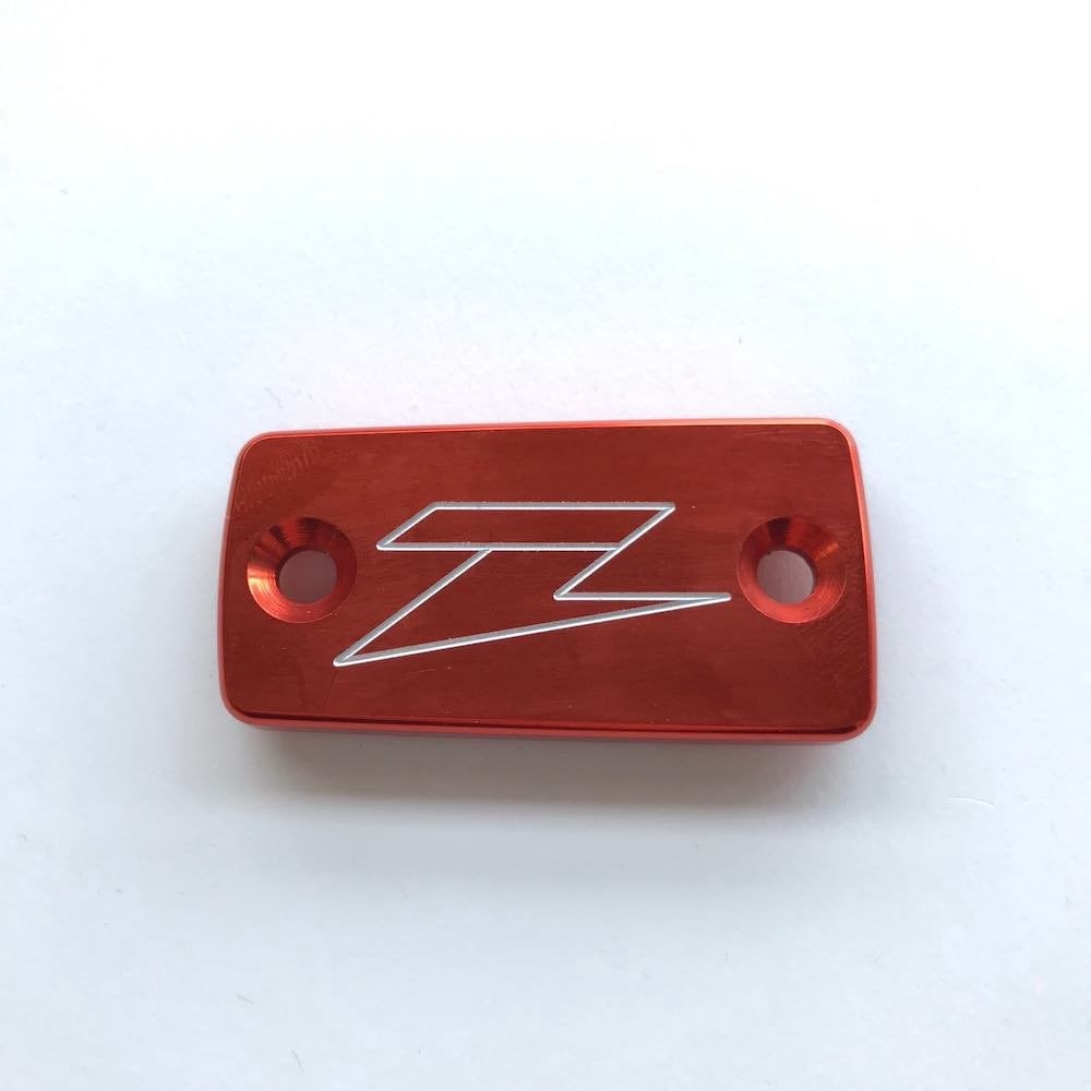 Zeta - Reservoir Cap - Clutch - KTM SX125/144/150 09-15, SXF450 09-12, EXC125/200 09-16, EXCF450 06-07, HUSQVARNA TC125 14-21, TC250 17-21, FC250-450 16-21, TE125 14-16, TE250/300 17-18, TE150 20-21, TE250/300 18-21, FE250-501 17-21 (Orange)