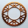 JT - Sprocket - Rear - JTA897/224U/TR130 - 520 - KTM 125-530 90-26, Husqvarna 125-501 14-26, Gas Gas 125-450 21-26, Triumph 250/450 24-26, STARK - Orange