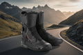 Pair of black motorcycle boots with brand logo on a white background