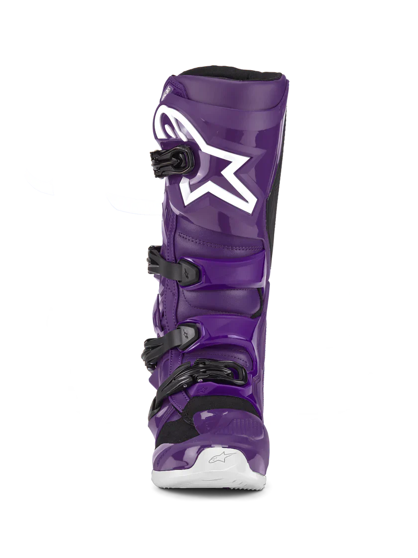 Purple motocross boot with a white star logo on a white background