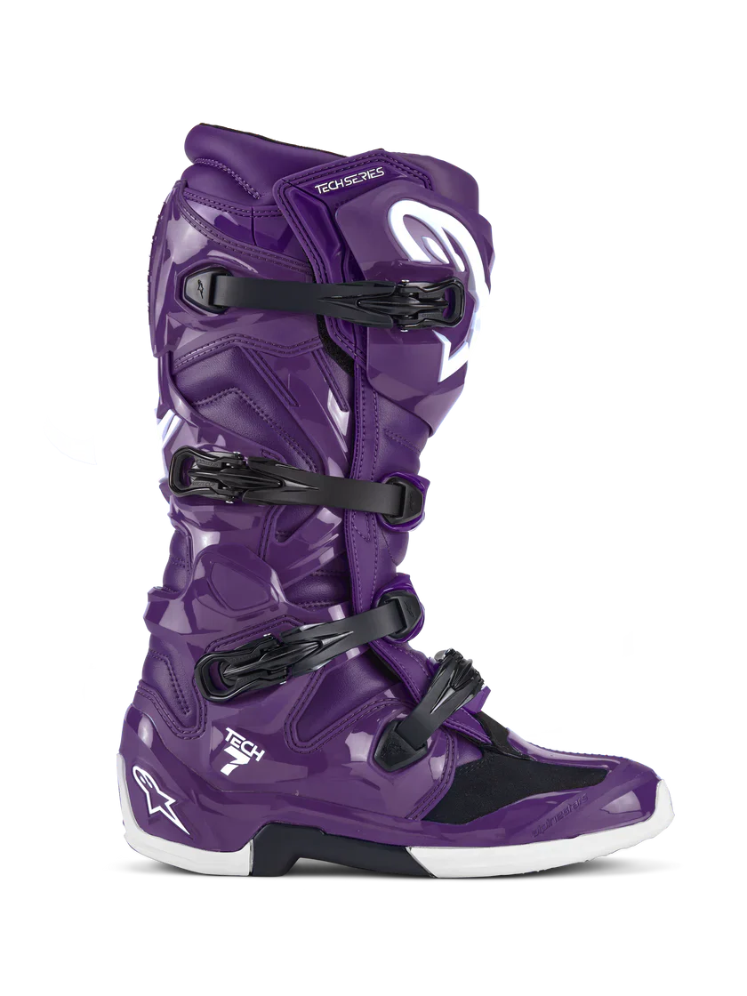 Purple motocross boot with black straps on a white background