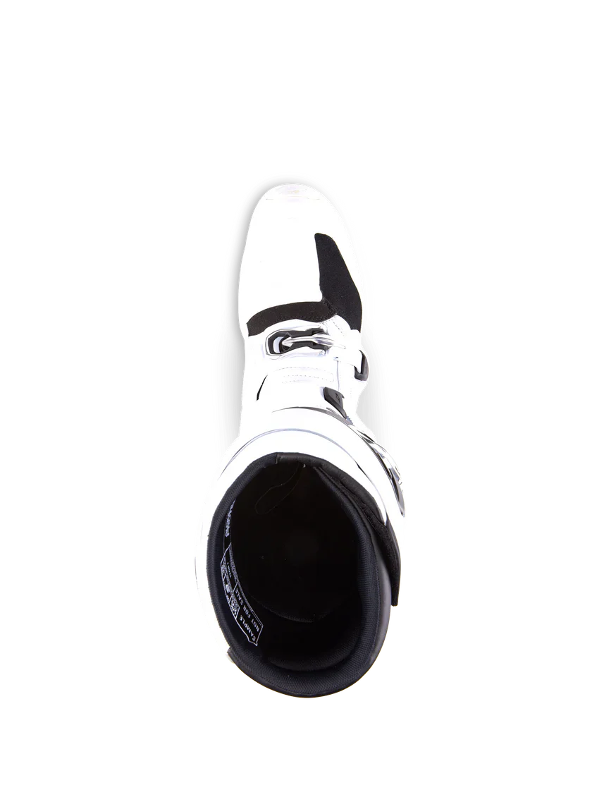 White motocross boot with black sole on a white background